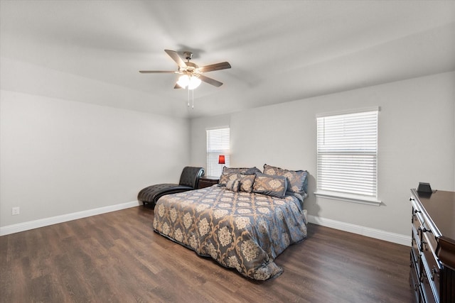 bedroom featuring dark hardwood / wood-style floors and ceiling fan