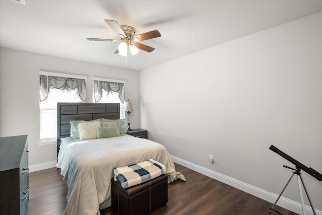 bedroom featuring ceiling fan and dark hardwood / wood-style floors