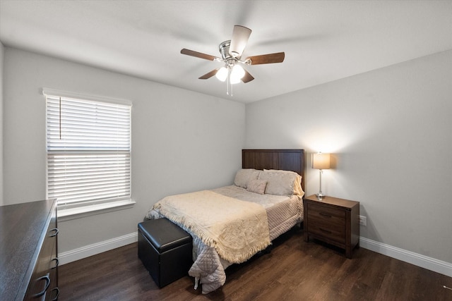 bedroom featuring multiple windows, ceiling fan, and dark wood-type flooring