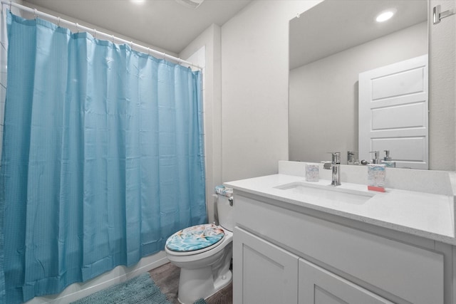 full bathroom with vanity, toilet, shower / bathtub combination with curtain, and wood-type flooring