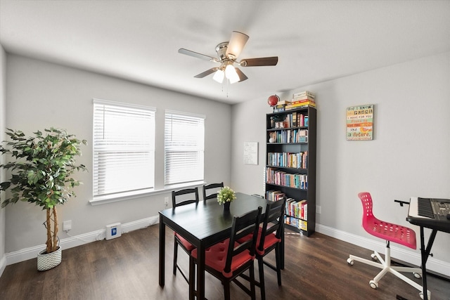 dining space with dark hardwood / wood-style floors and ceiling fan