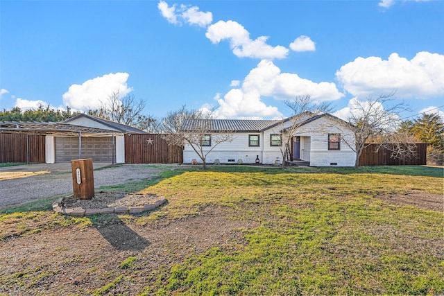 ranch-style house featuring a garage and a front yard