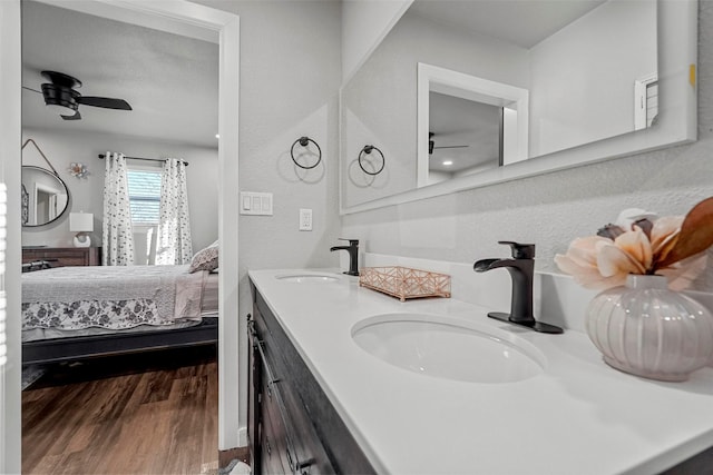 bathroom featuring ceiling fan, vanity, and hardwood / wood-style flooring