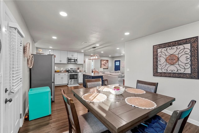 dining room with dark wood-type flooring