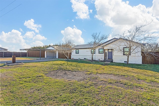 ranch-style house featuring a garage and a front lawn