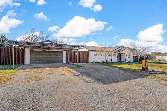 single story home featuring a front yard and a garage