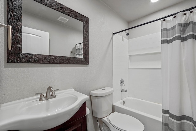 full bathroom featuring toilet, vanity, and shower / tub combo