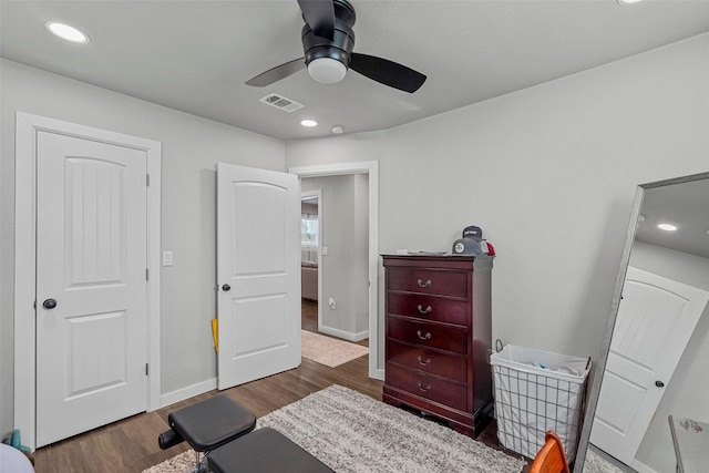 bedroom featuring ceiling fan and dark hardwood / wood-style floors