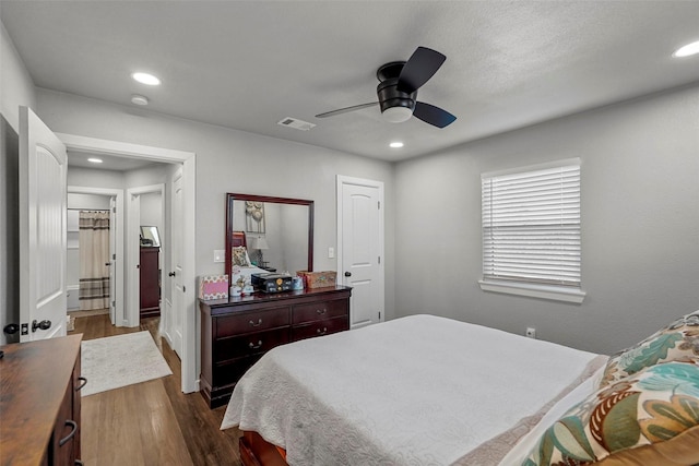 bedroom with dark wood-type flooring and ceiling fan