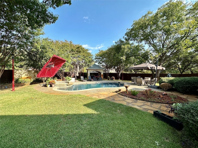 view of yard with a gazebo, a fenced in pool, and a patio