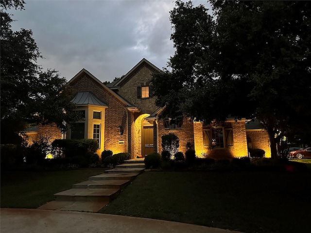 front facade with a front lawn