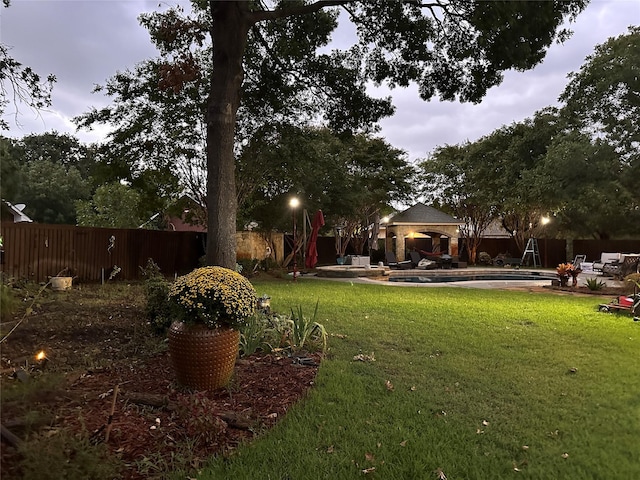 view of yard with a fenced in pool