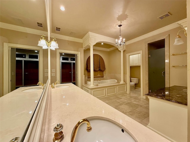 full bathroom with toilet, vanity, an inviting chandelier, and decorative columns