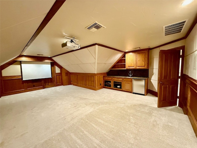 interior space with light colored carpet and lofted ceiling