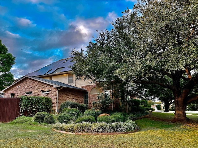 view of home's exterior with a yard