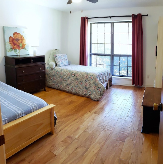 bedroom featuring ceiling fan and light hardwood / wood-style floors