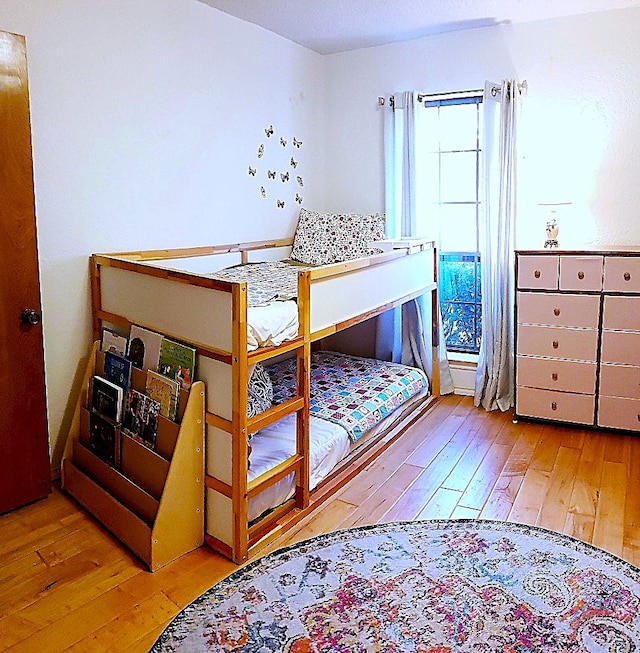 bedroom with light hardwood / wood-style flooring