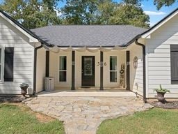 rear view of property featuring a patio