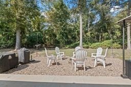 view of patio / terrace with an outdoor fire pit