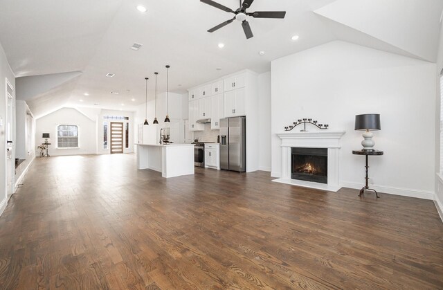 bonus room featuring vaulted ceiling and dark hardwood / wood-style floors