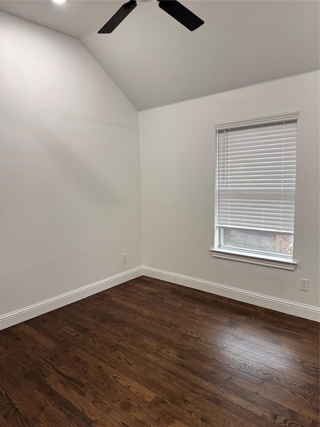 unfurnished room featuring dark wood-type flooring, ceiling fan, and vaulted ceiling