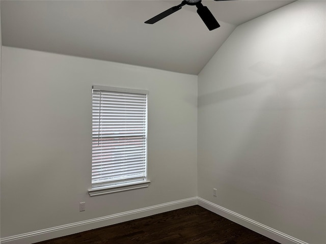 unfurnished room with dark wood-type flooring, vaulted ceiling, and ceiling fan