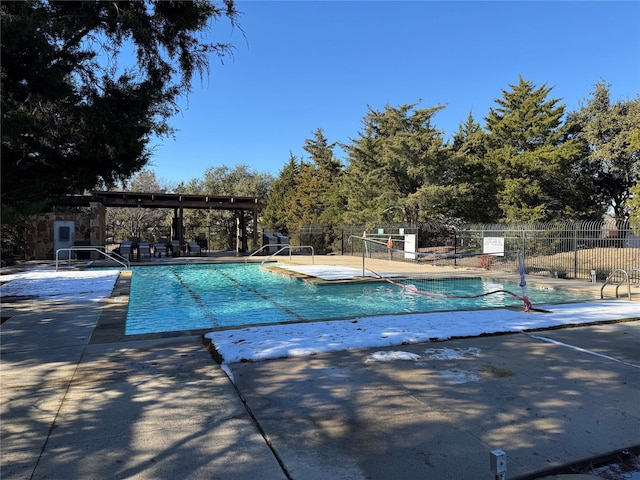 view of swimming pool with a patio