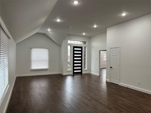 foyer featuring lofted ceiling and dark wood-type flooring