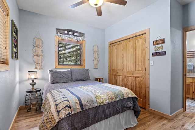 bedroom with light hardwood / wood-style flooring, a closet, and ceiling fan