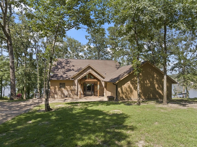 ranch-style home with a front lawn