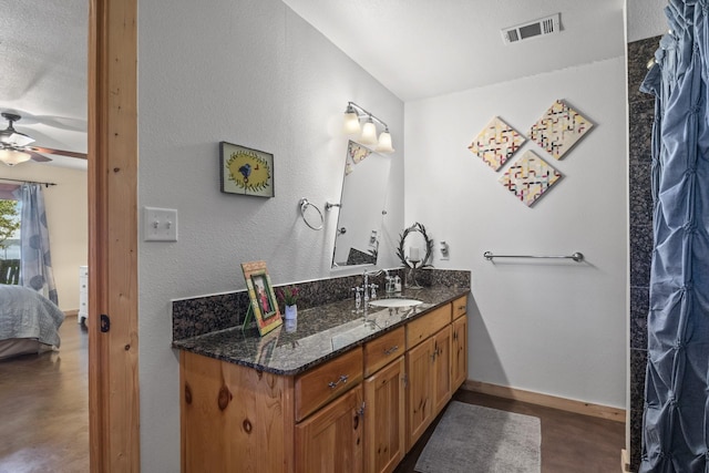 bathroom featuring vanity and ceiling fan