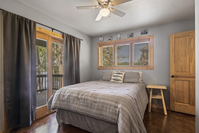 bedroom with access to outside and ceiling fan