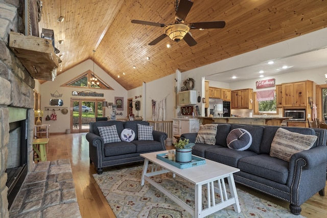 living room featuring wood ceiling, ceiling fan, high vaulted ceiling, a fireplace, and light hardwood / wood-style floors