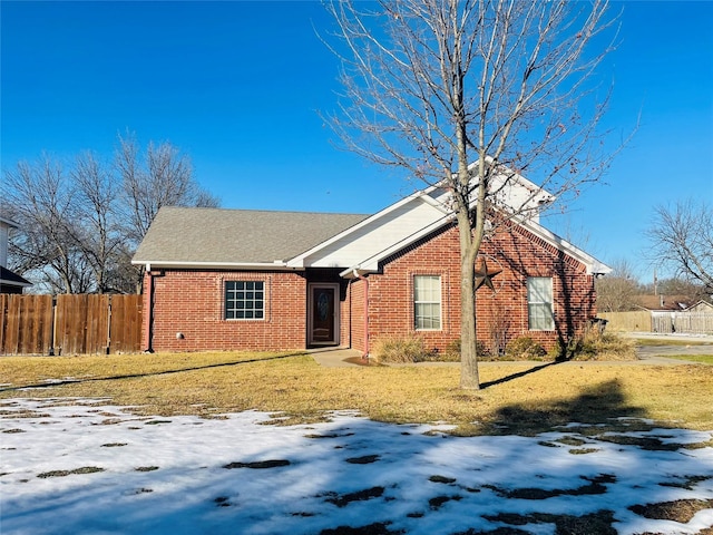 ranch-style house featuring a yard