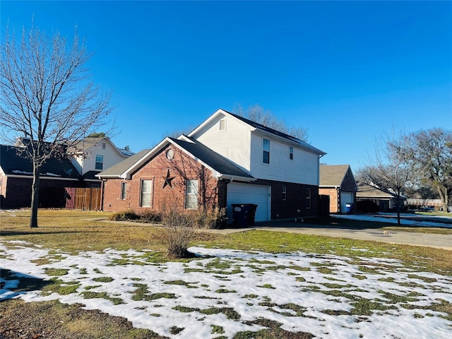 view of snow covered exterior featuring a lawn