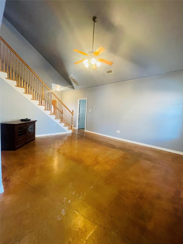 unfurnished living room featuring ceiling fan, concrete flooring, and vaulted ceiling