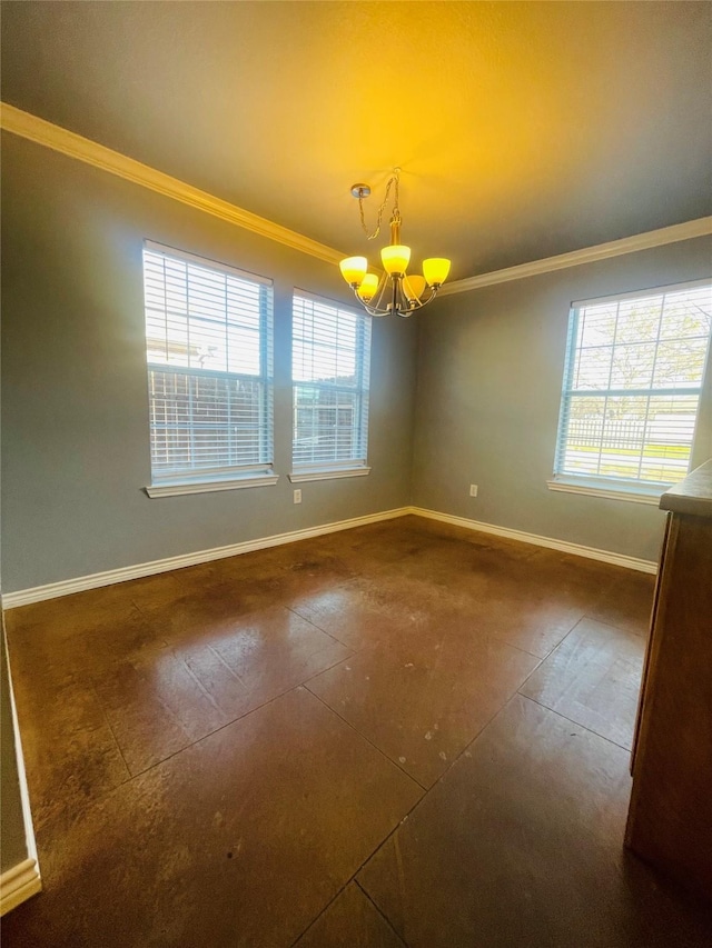 spare room featuring a chandelier and ornamental molding