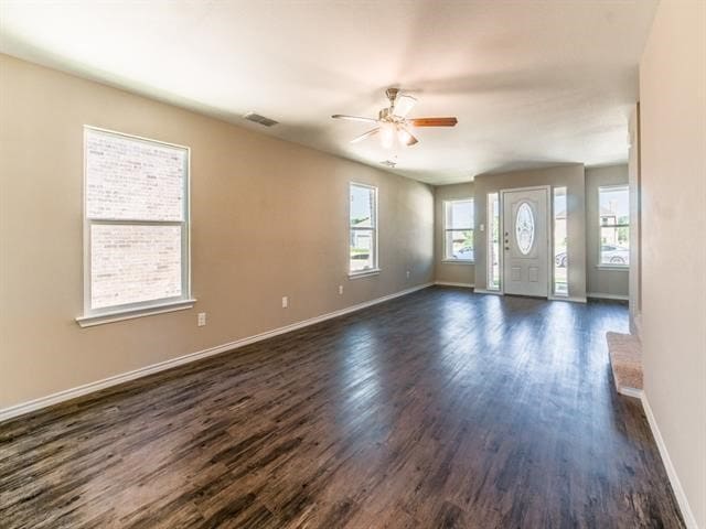 foyer with dark hardwood / wood-style floors and ceiling fan