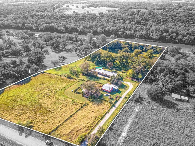 back of property featuring a lawn and solar panels