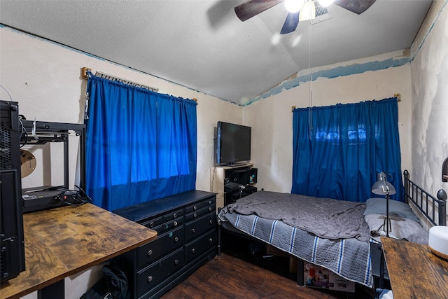 bedroom featuring a textured ceiling, ceiling fan, dark hardwood / wood-style floors, and lofted ceiling