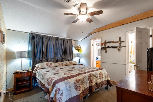 bedroom with connected bathroom, carpet floors, vaulted ceiling, and ceiling fan