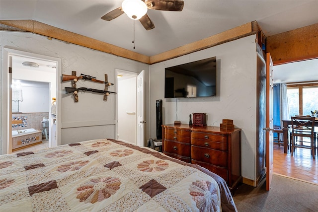 carpeted bedroom with connected bathroom and ceiling fan