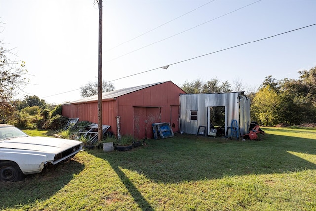 view of outbuilding with a lawn