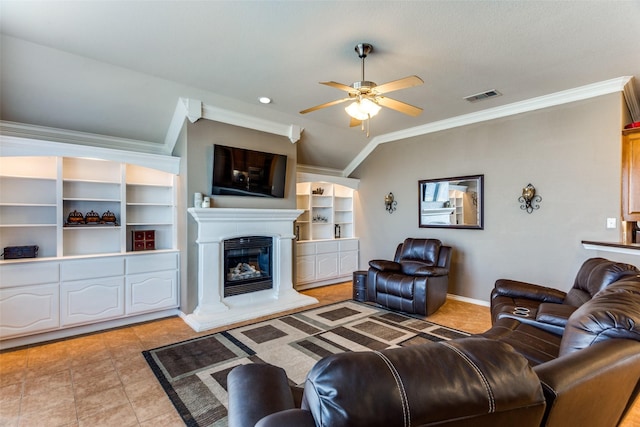 living room featuring ceiling fan, ornamental molding, and vaulted ceiling