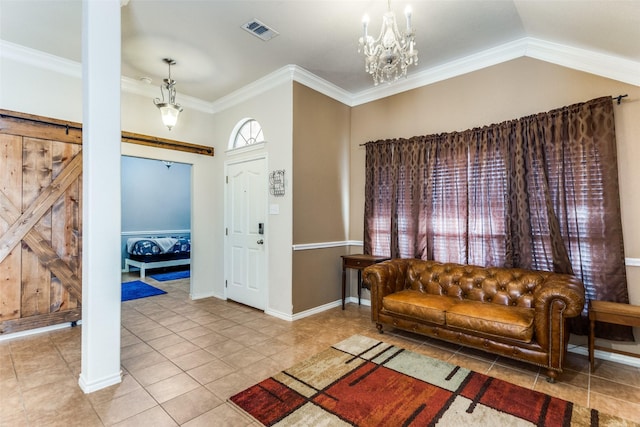 tiled entryway with a notable chandelier, a barn door, ornamental molding, and lofted ceiling