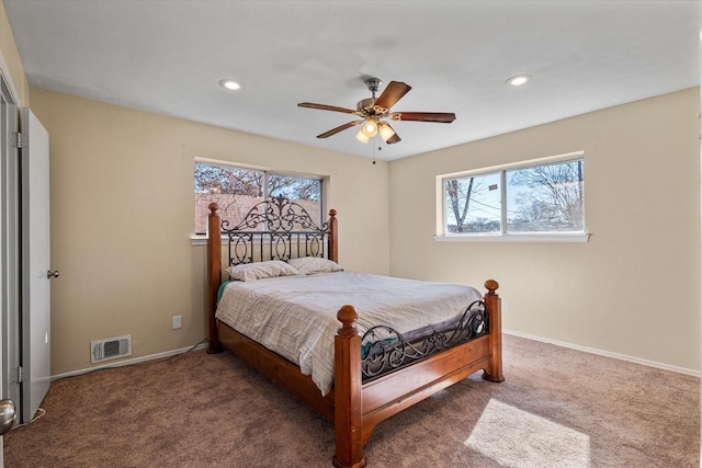 carpeted bedroom featuring ceiling fan