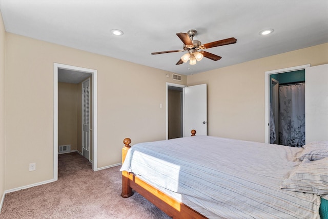 bedroom with ceiling fan and light colored carpet