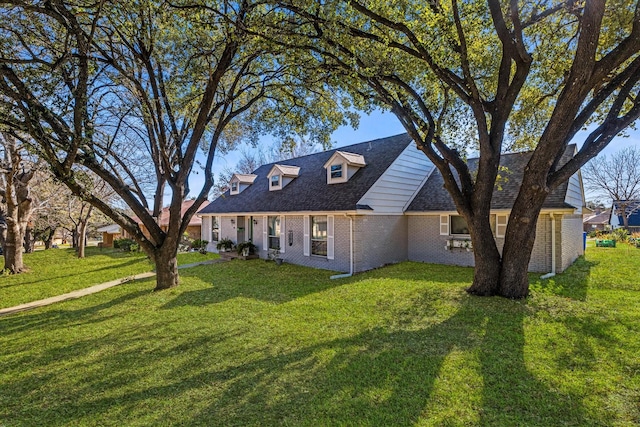 new england style home featuring a front yard