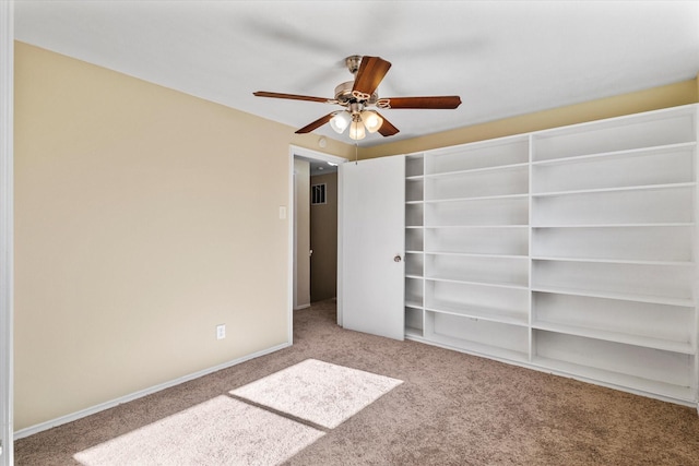 unfurnished bedroom with carpet flooring and ceiling fan