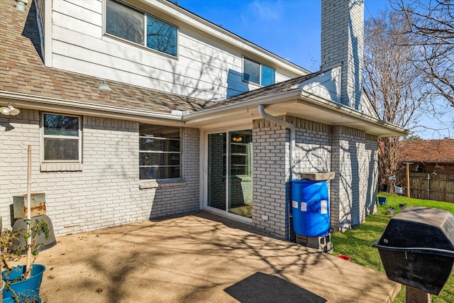 rear view of property featuring a patio area